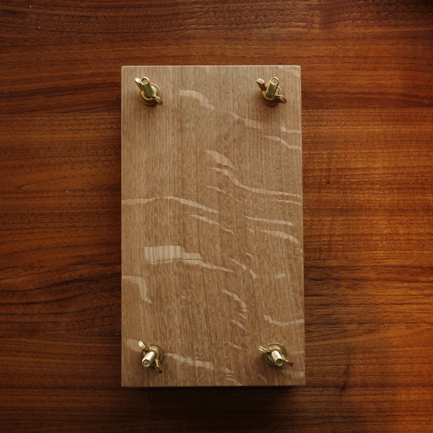 Wood flower press with brass bolts.