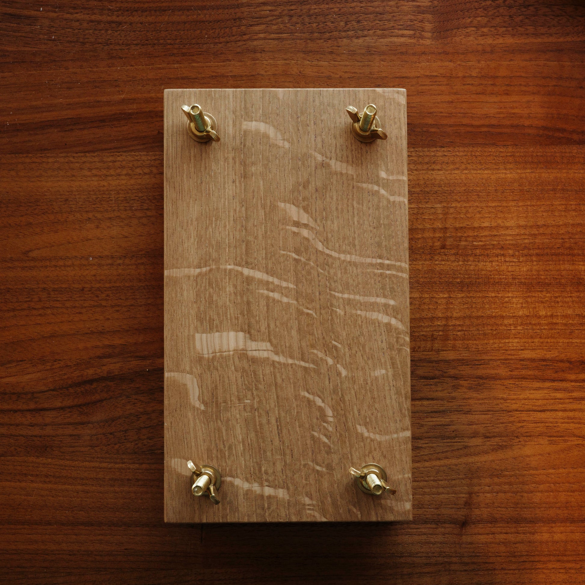 Wood flower press with brass bolts.