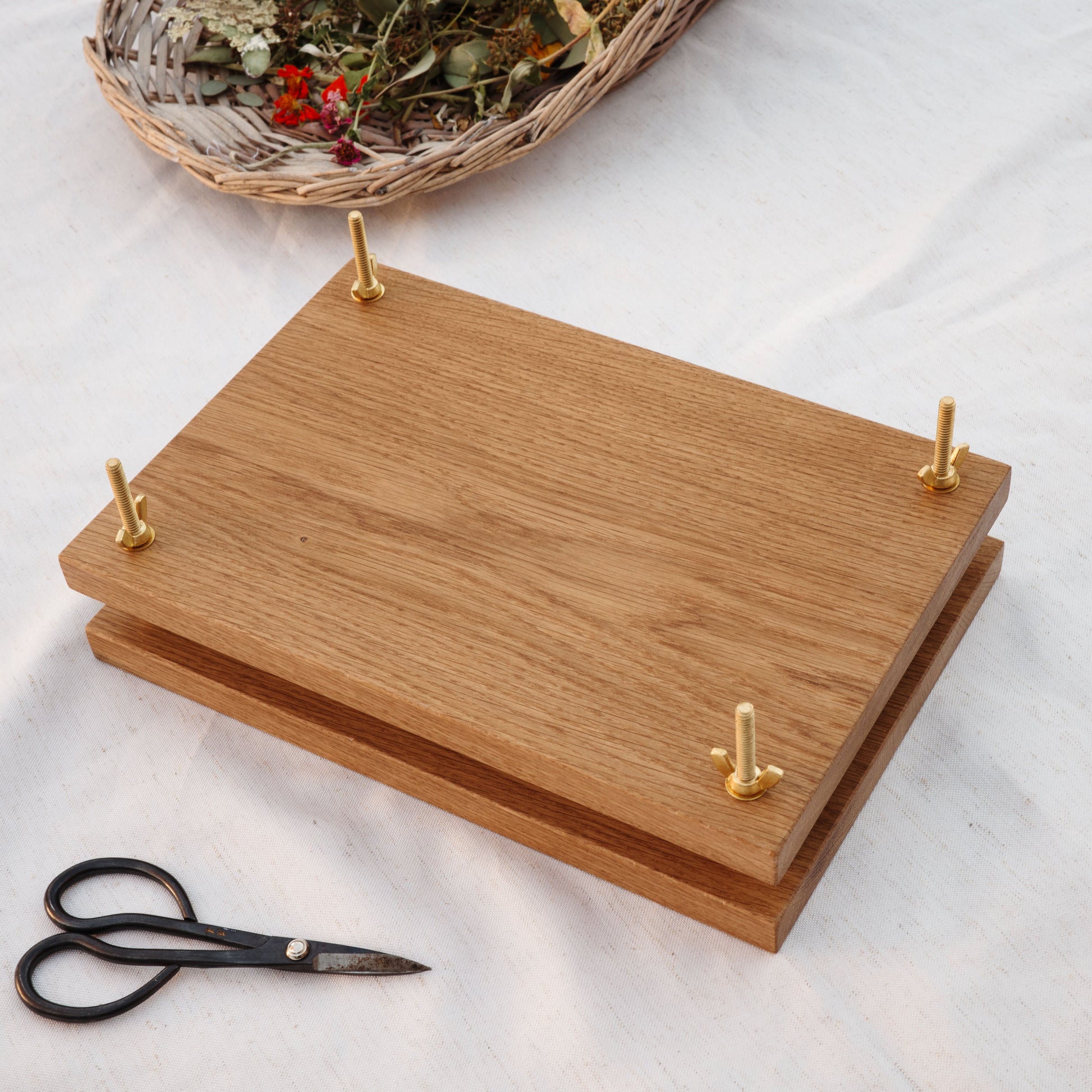 White oak flower press with brass bolts