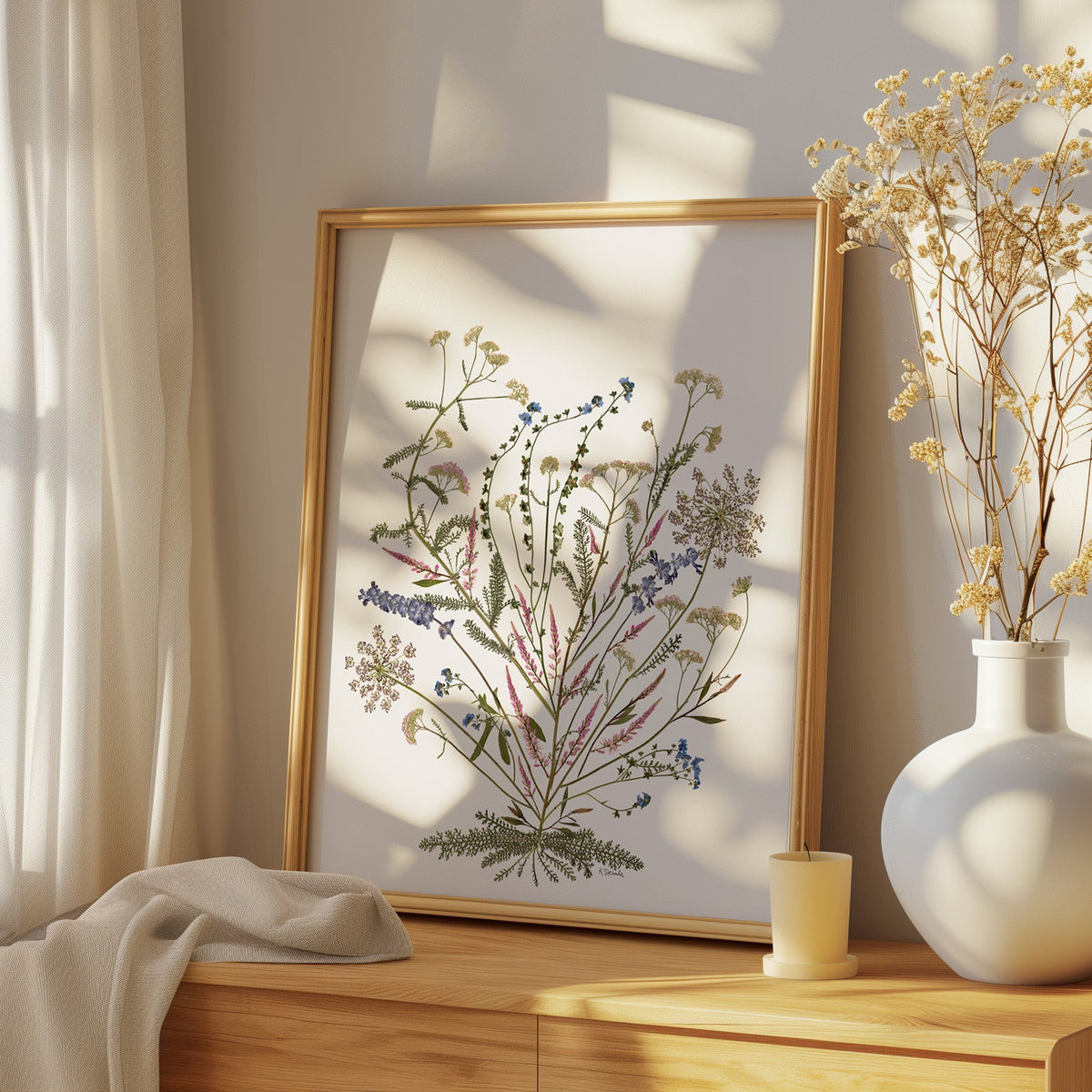 fine art print of pressed flower collage on dresser in a bedroom.